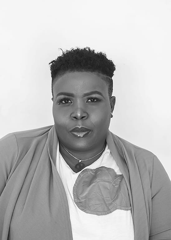 portrait of a woman staring at a camera as she poses.