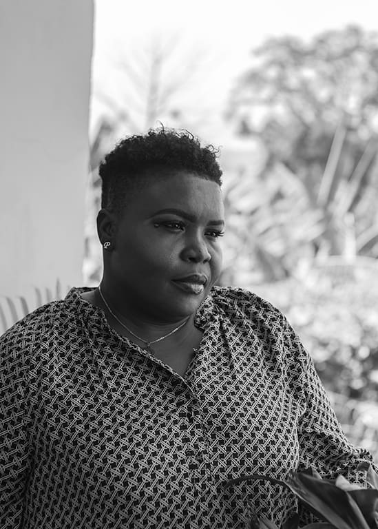 image of a woman gazing at an object outside the image-frame